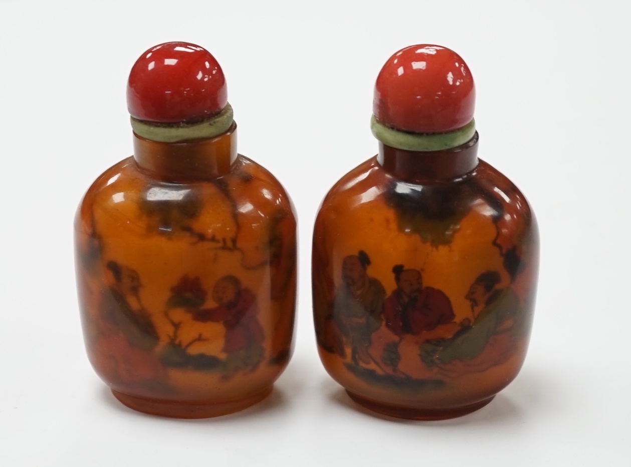 Two Chinese glass snuff bottles, internally painted with figures, 8cm high